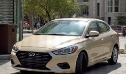 Car photo with inconsistent background element.