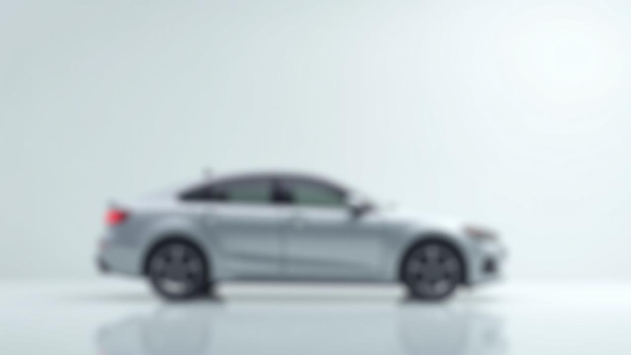 After: Same car in a clean, professional showroom background.